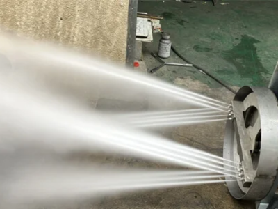 Close-up of a powerful multi-nozzle High Pressure Water Jetting system discharging high-velocity water streams for a thorough Sewer Line Inspection and cleaning.